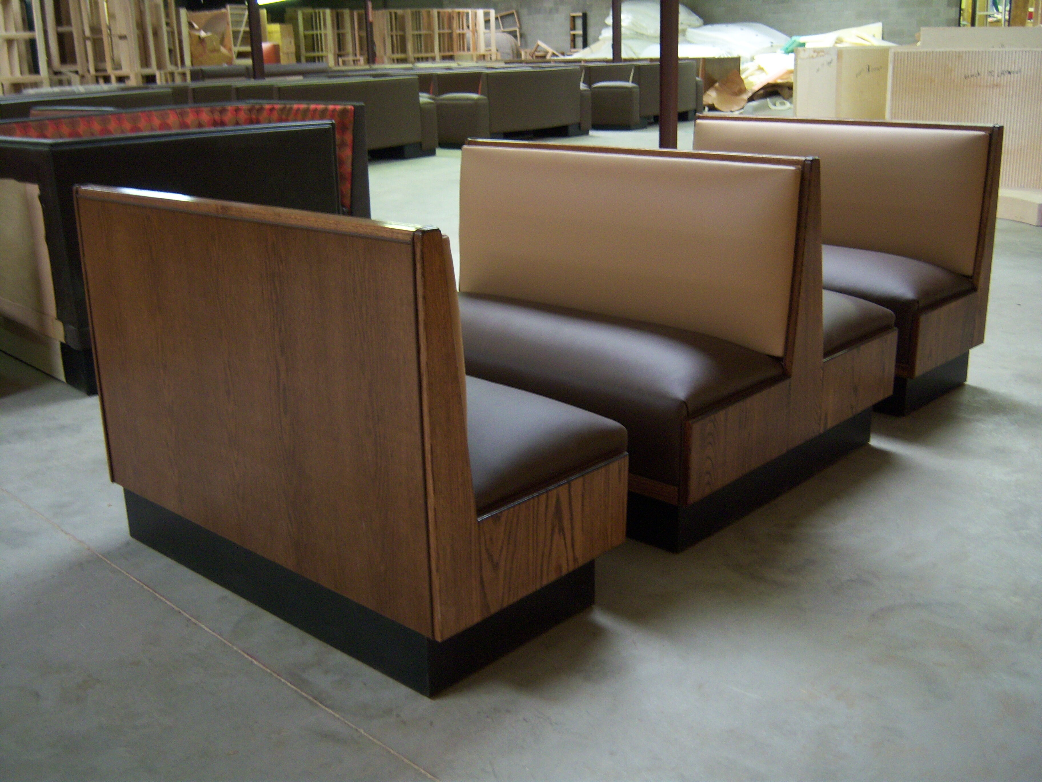 Standard commercial booth seating with upholstered backs and seats